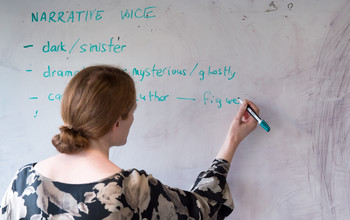 An academic writing on a whiteboard at the ɫ